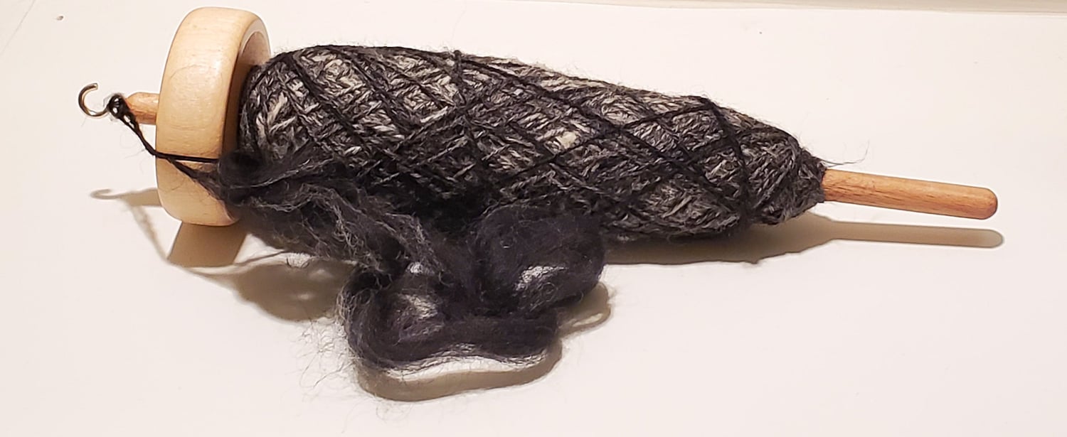 gradient wool spun on a drop spindle