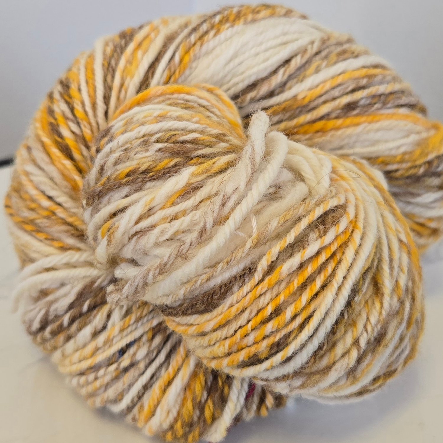 brown, gold, white handwoven skein