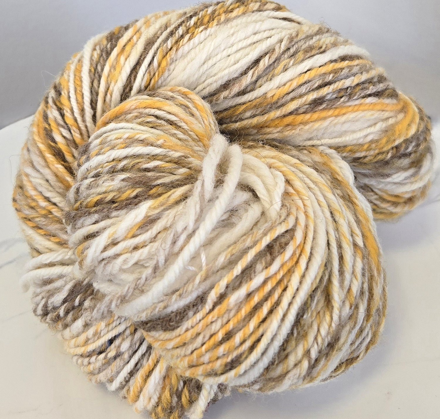 gold, white, brown handspun skein
