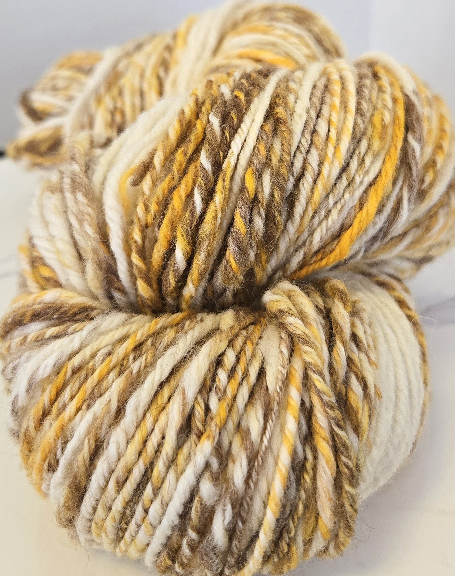 white, gold, & brown yarn