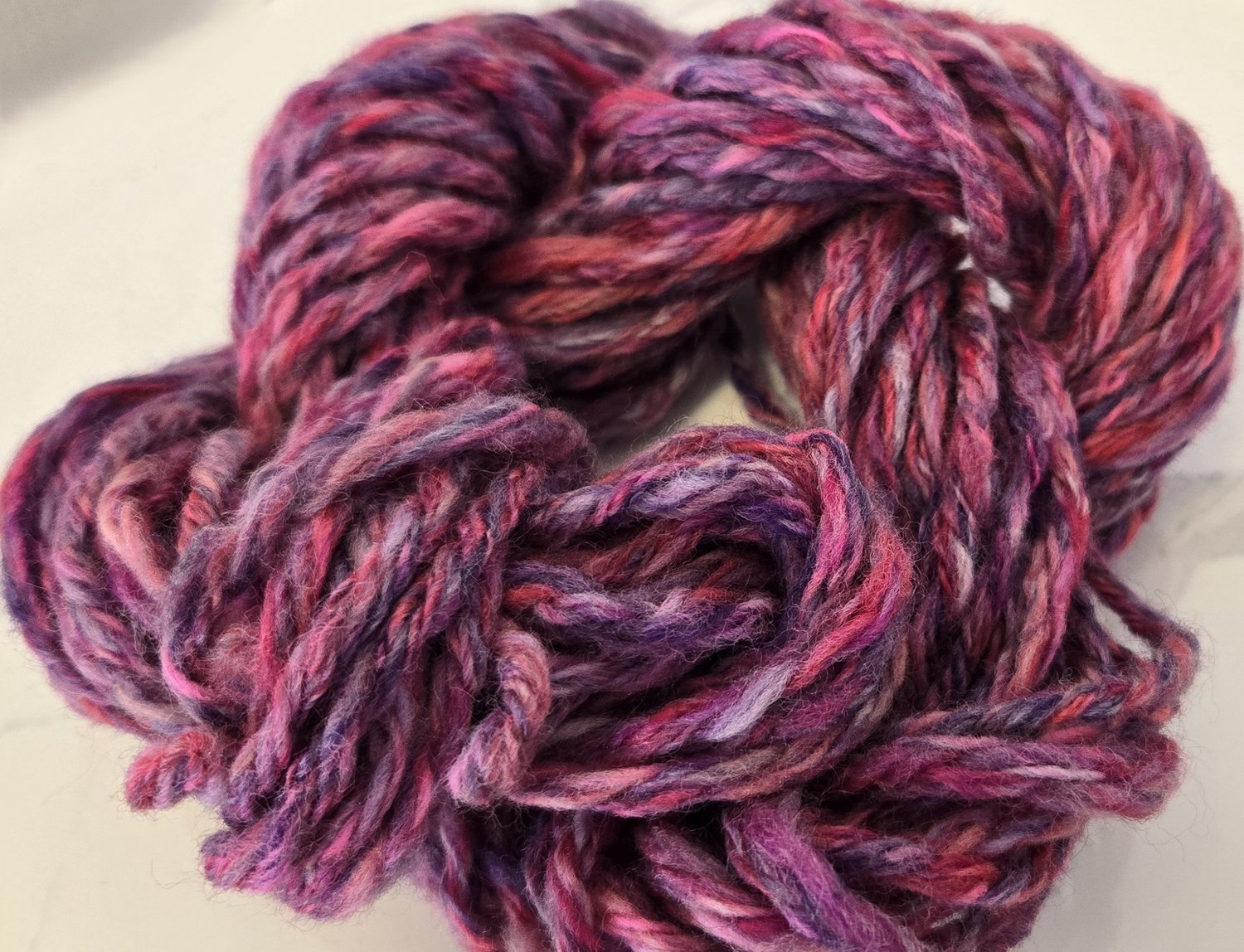 handspun pink and purple pastel goth wool yarn skein