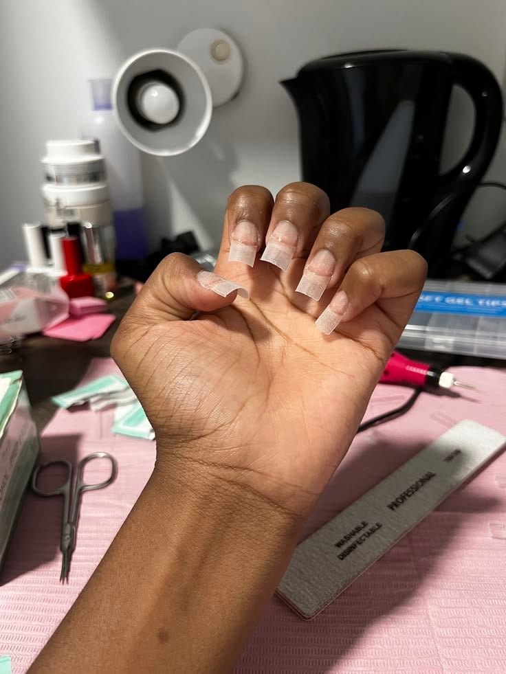 Nail technician upselling services professionally to grow the business and improve client experience.