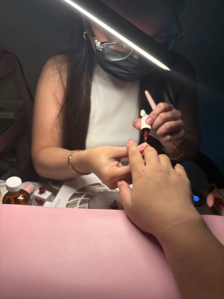 Nail technician pricing services effectively for profit and client satisfaction.