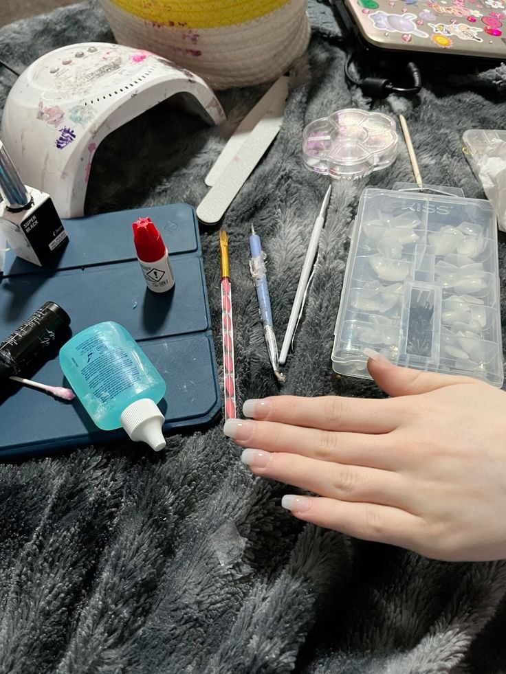 Nail technician showcasing a professional service menu to attract clients and boost bookings.