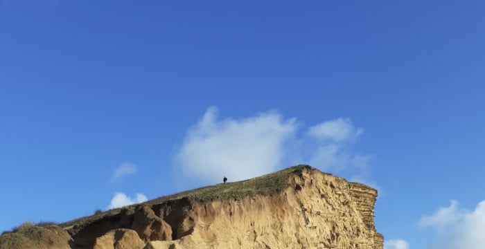person at the top of a hill