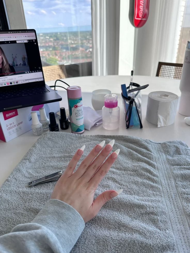 Nail technician marketing nail services on Instagram to attract clients and grow the business.