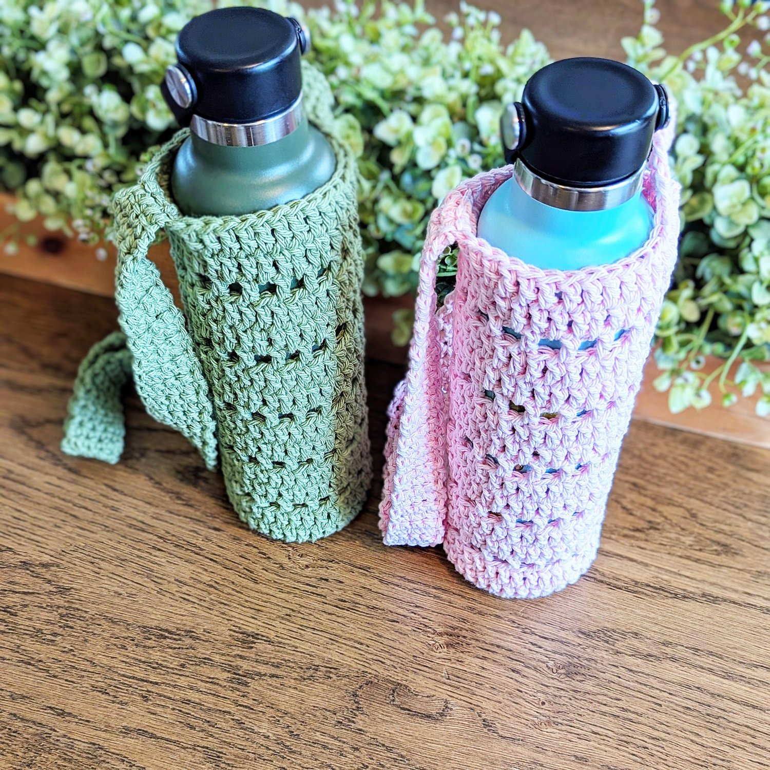 green and pink water bottle holder on table