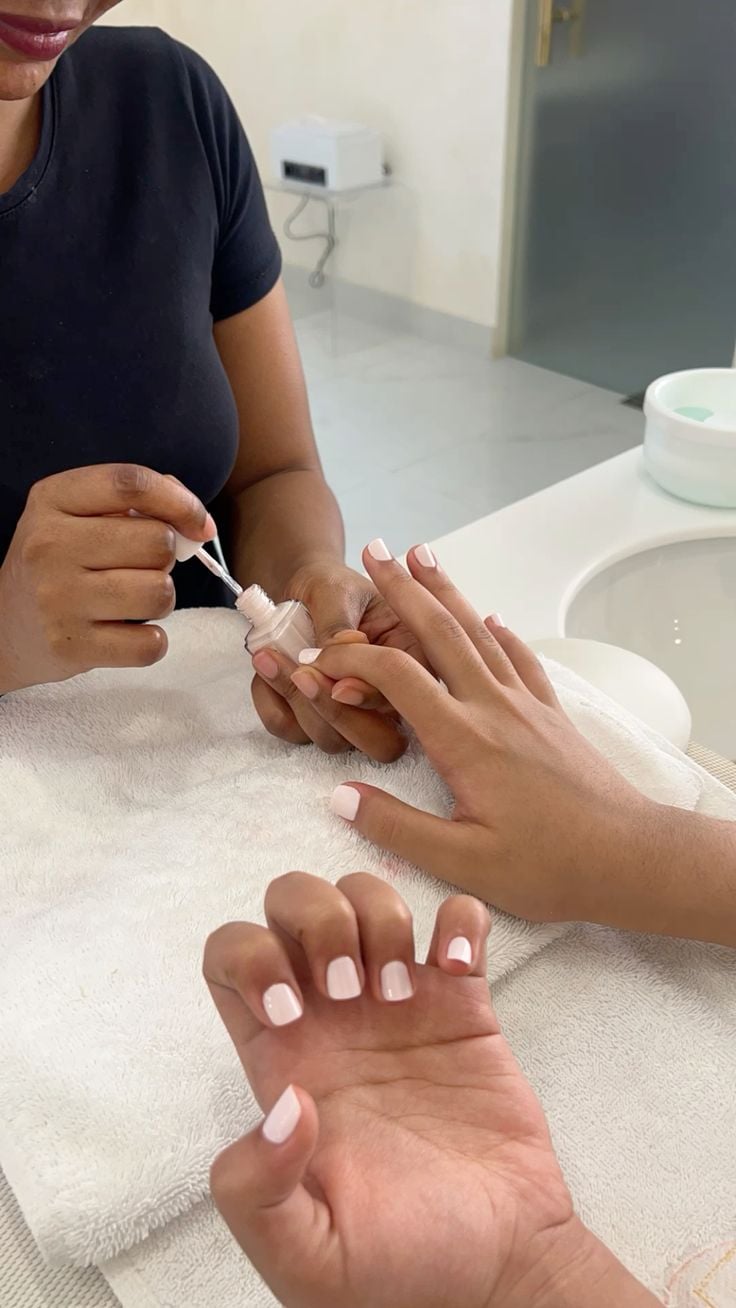 Nail technician pricing services to maximize profit and client satisfaction.