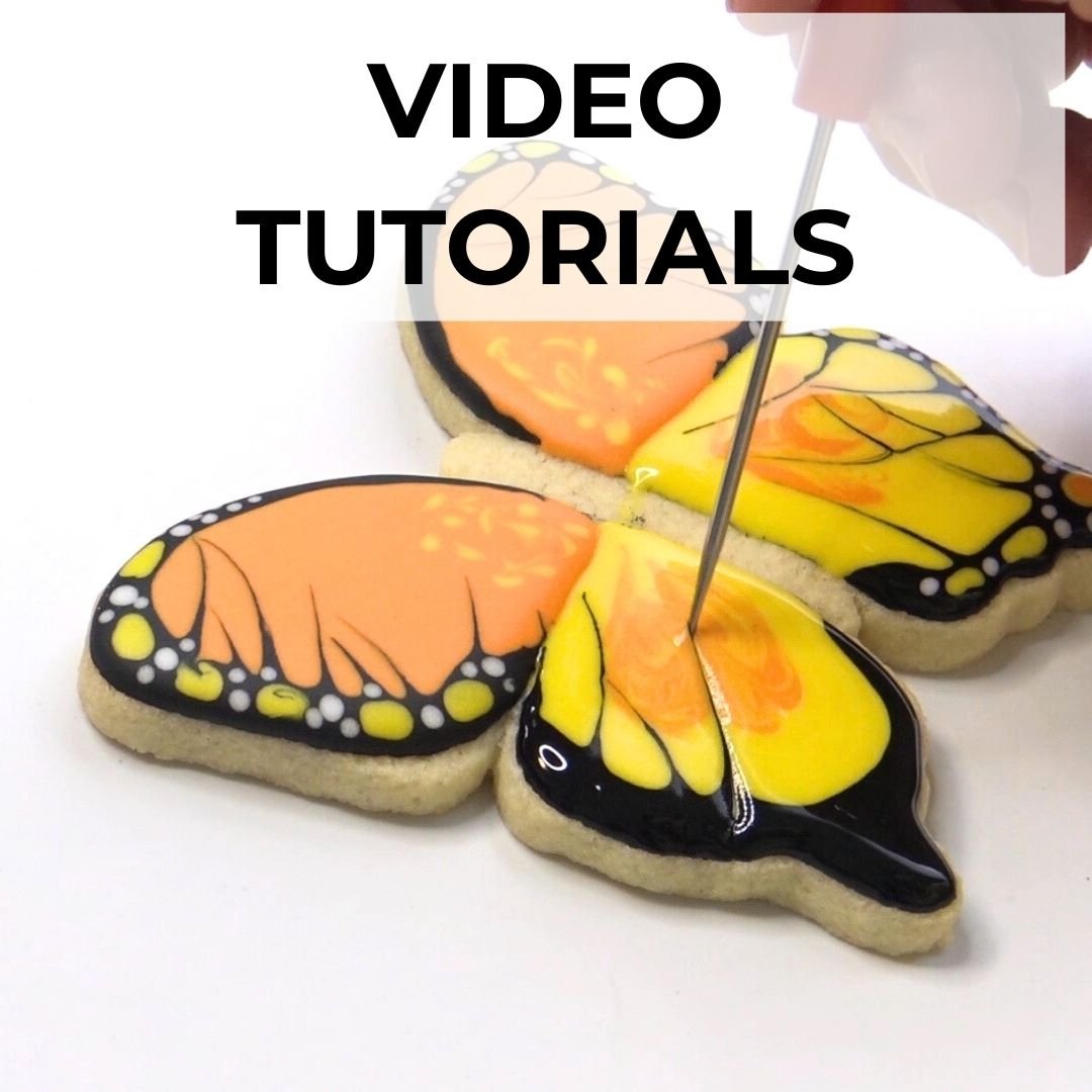 Cookie in a shape of a butterfly decorated with icing.