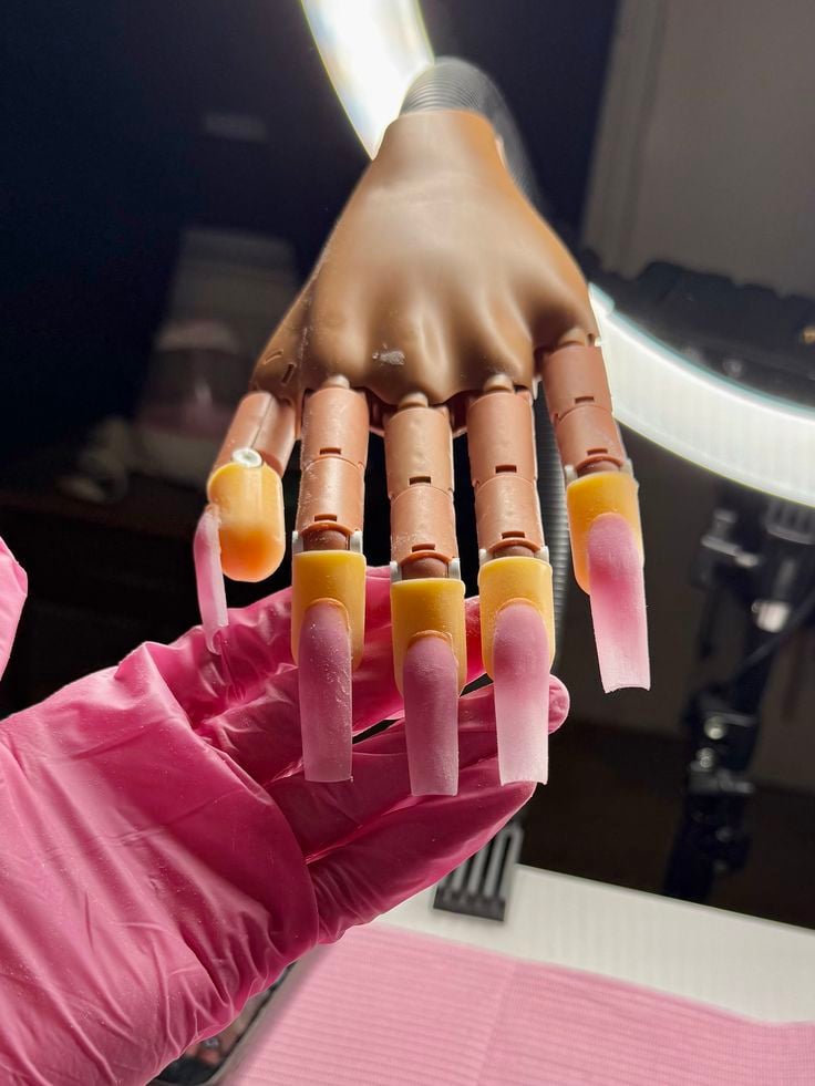 Nail technician using email marketing to keep clients engaged and returning.