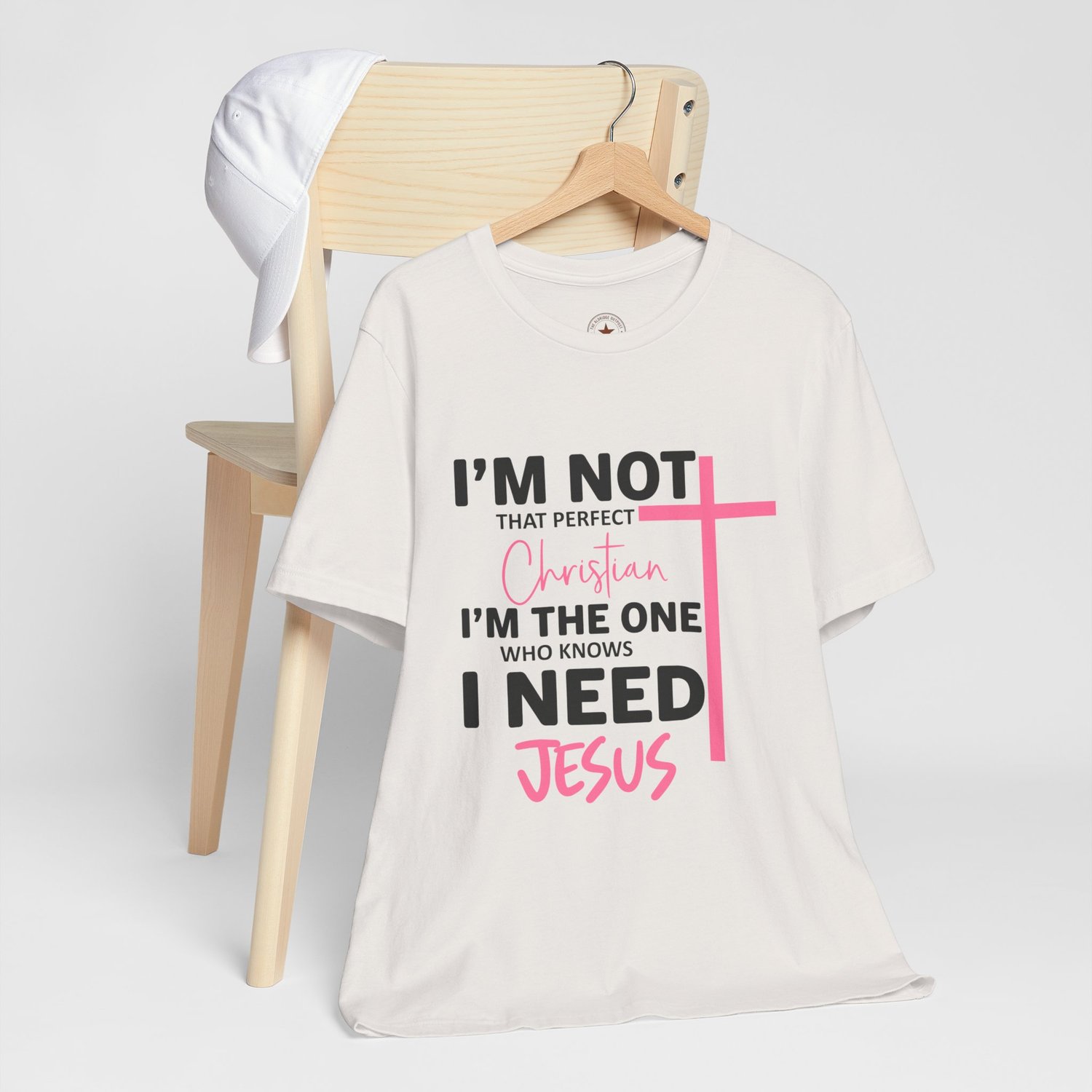 Signature Christian graphic tee in Vintage White featuring Im not that perfect Christian quote in soft Spring Pink and black text.