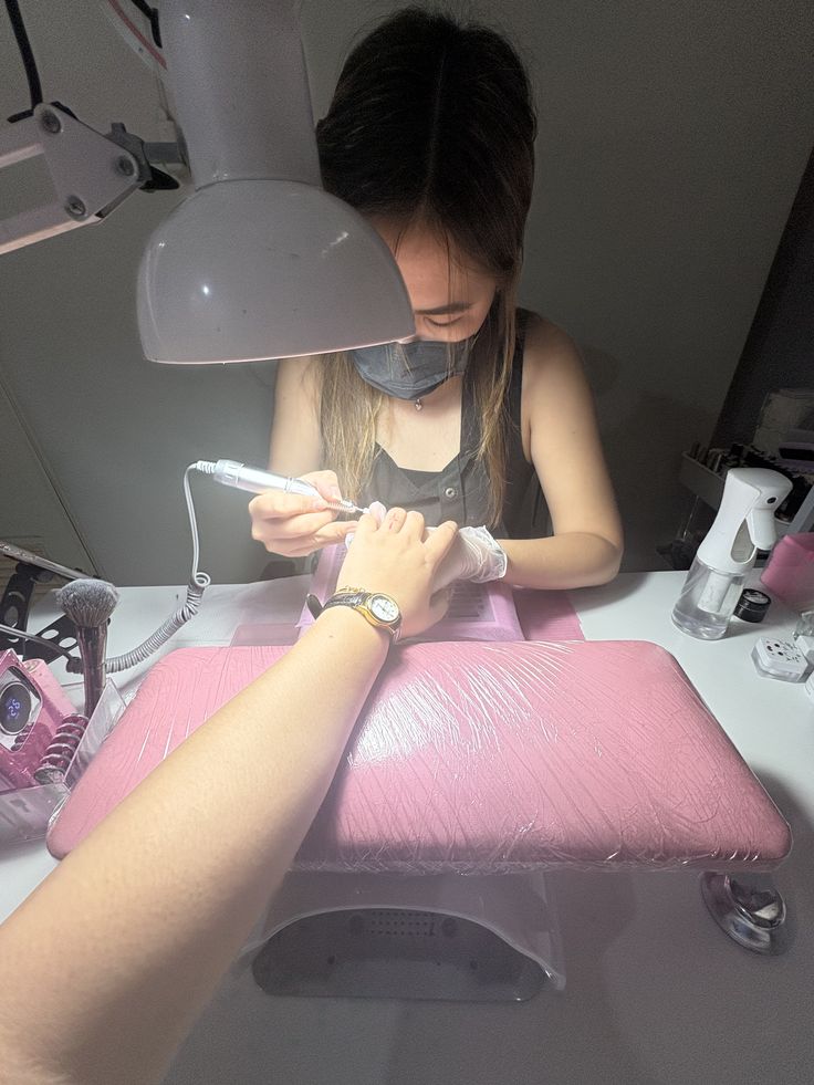 Nail technician implementing a loyalty program to retain clients and grow the business.