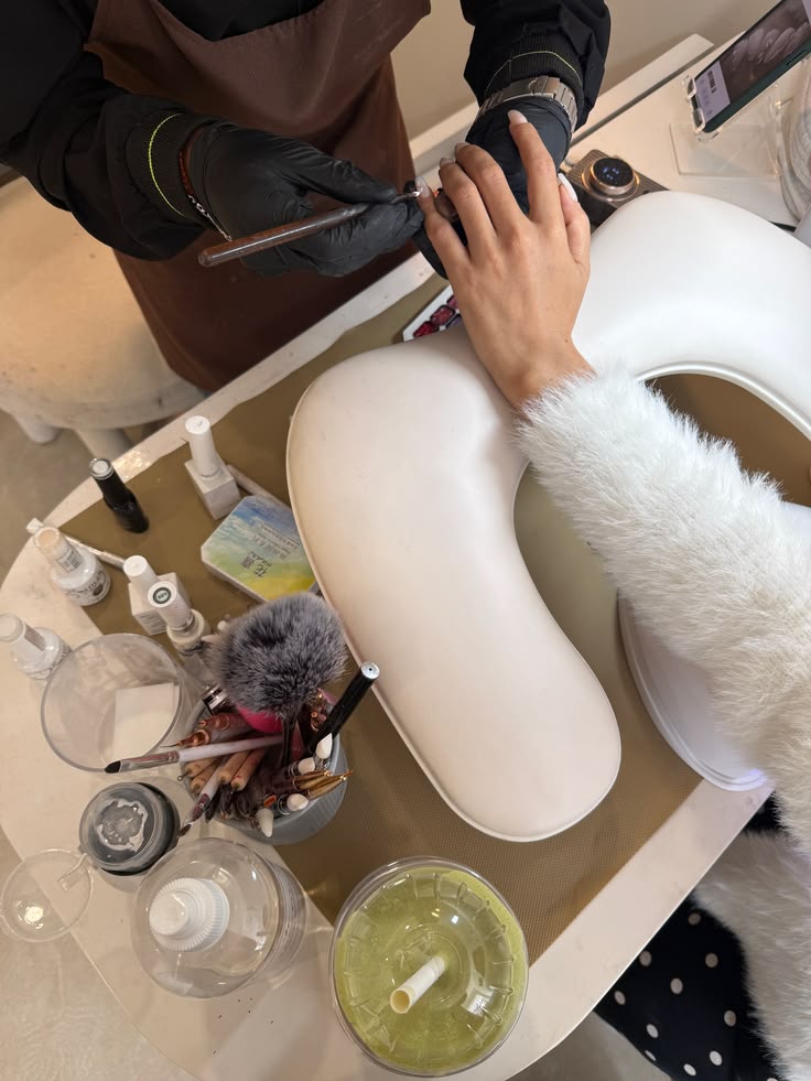 Nail salon with seasonal decorations and colorful nails promoting special offers.