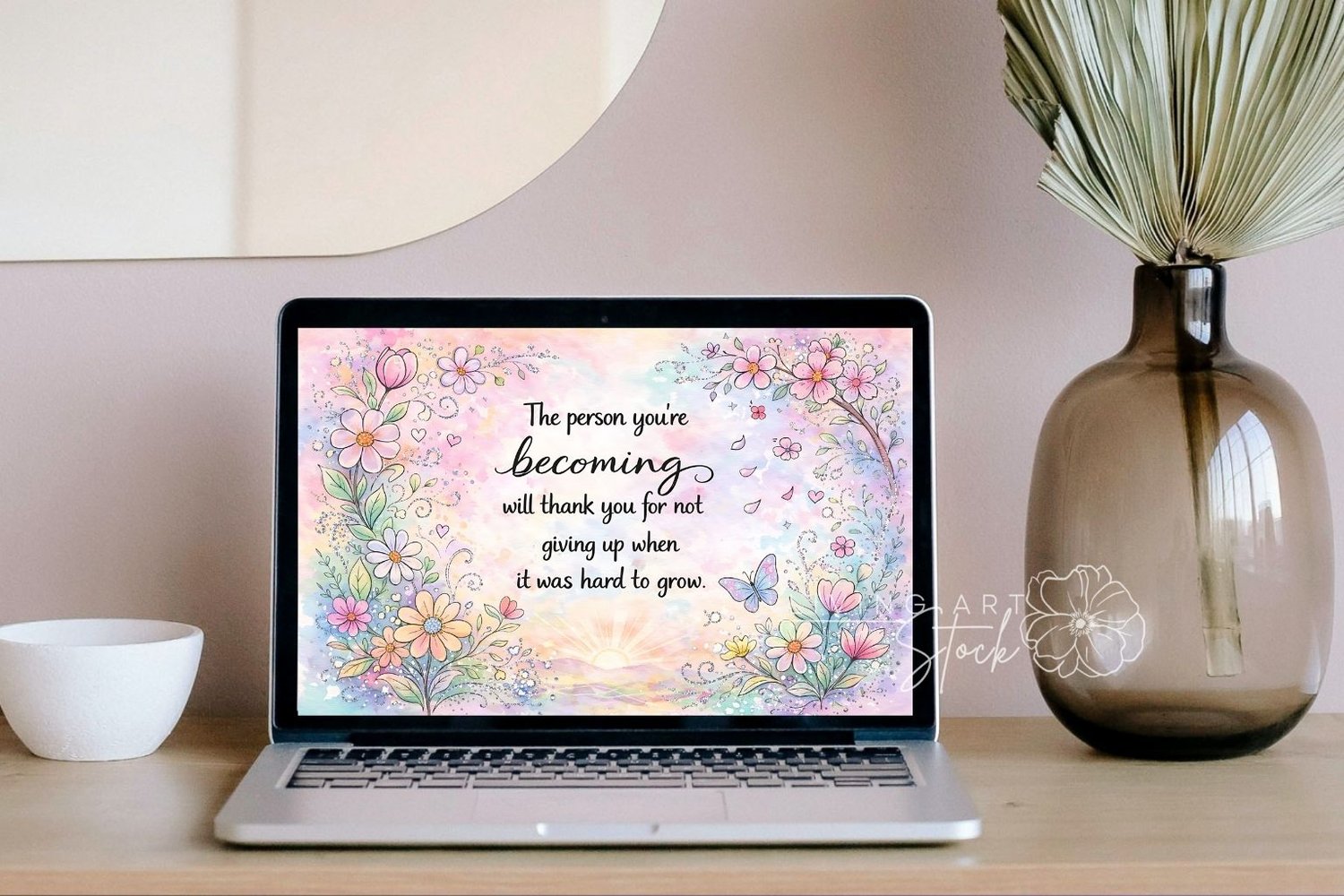 A delicate watercolor illustration features a variety of pink, peach, and light blue flowers and a butterfly forming a border around the central text: "The person youre becoming will thank you for not giving up when it was hard to grow." The background i