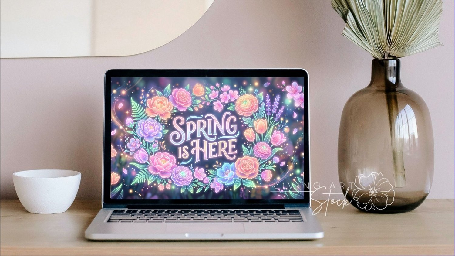 Colorful floral illustration features the phrase "Spring is Here" surrounded by a vibrant arrangement of various flowers, including roses, peonies, and tulips. The flowers are depicted in a swirling pattern with hues of pink, orange, blue, and purple. Lea