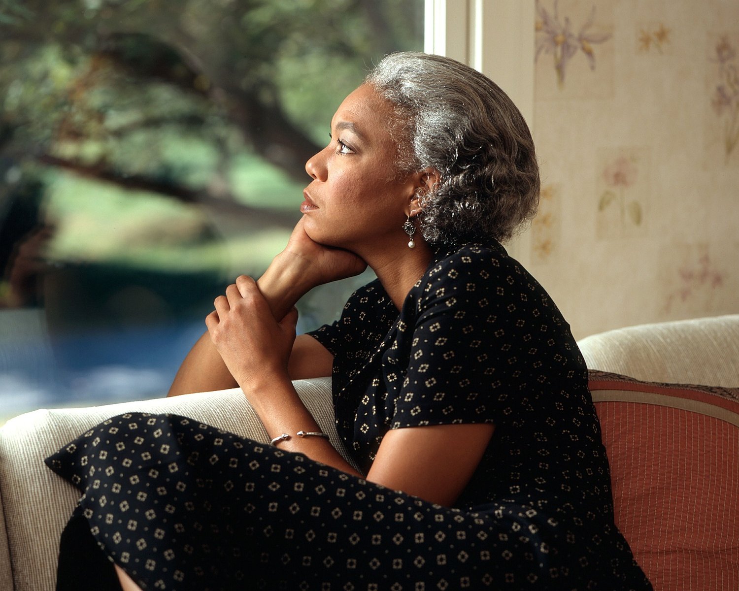 An African American woman embracing herself because she has made the commitment to 