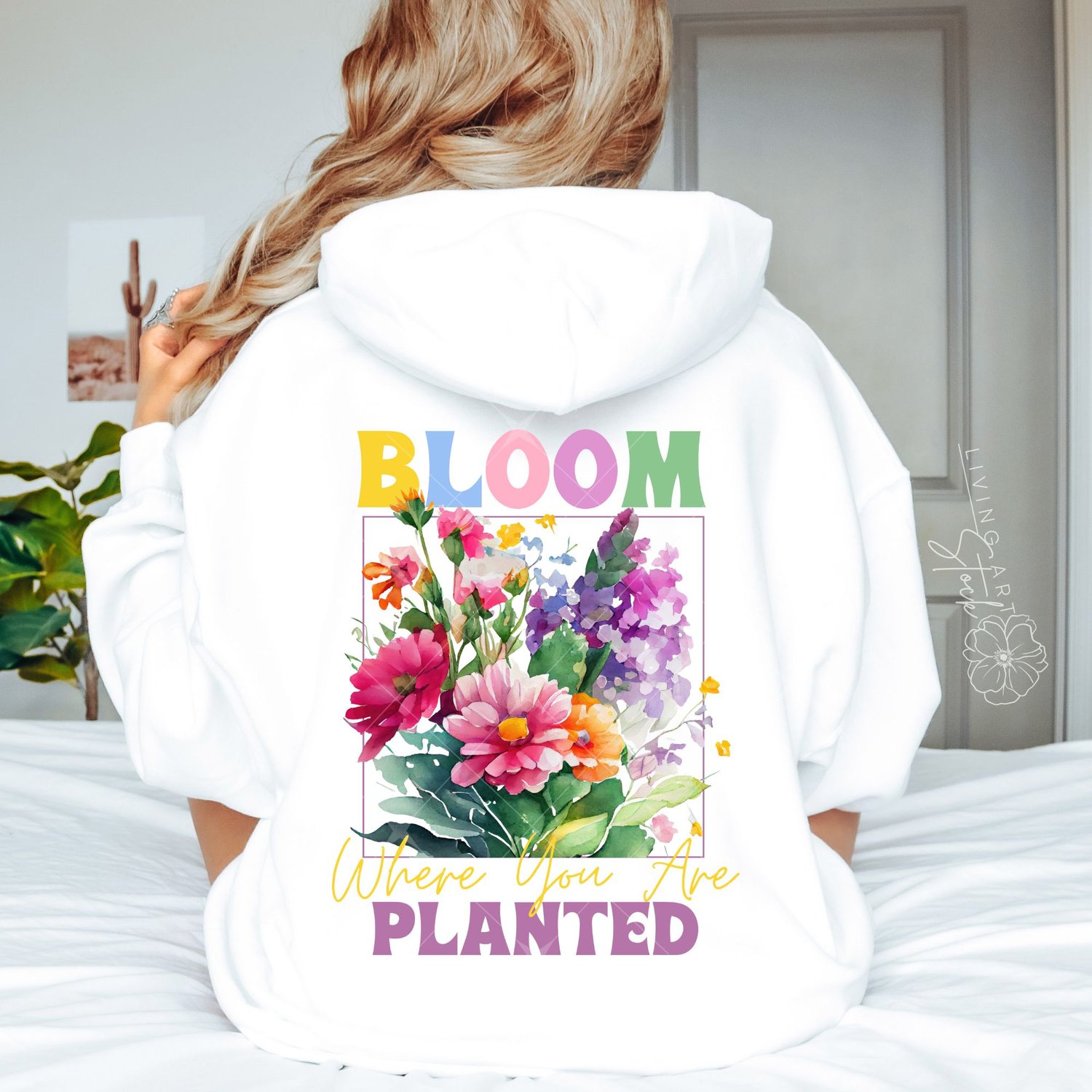 Colorful watercolor spring art design with "Bloom Where You Are Planted" quote centered with Spring watercolor flowers on white hoodie sweatshirt