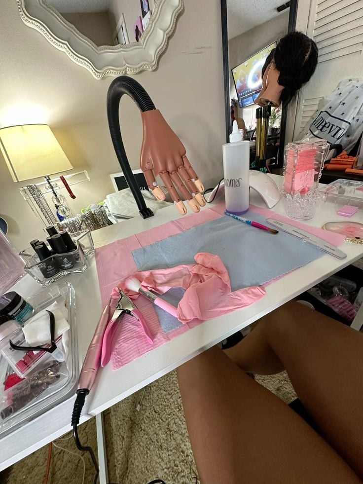 Nail technician exploring current trends to offer innovative services in a professional salon.