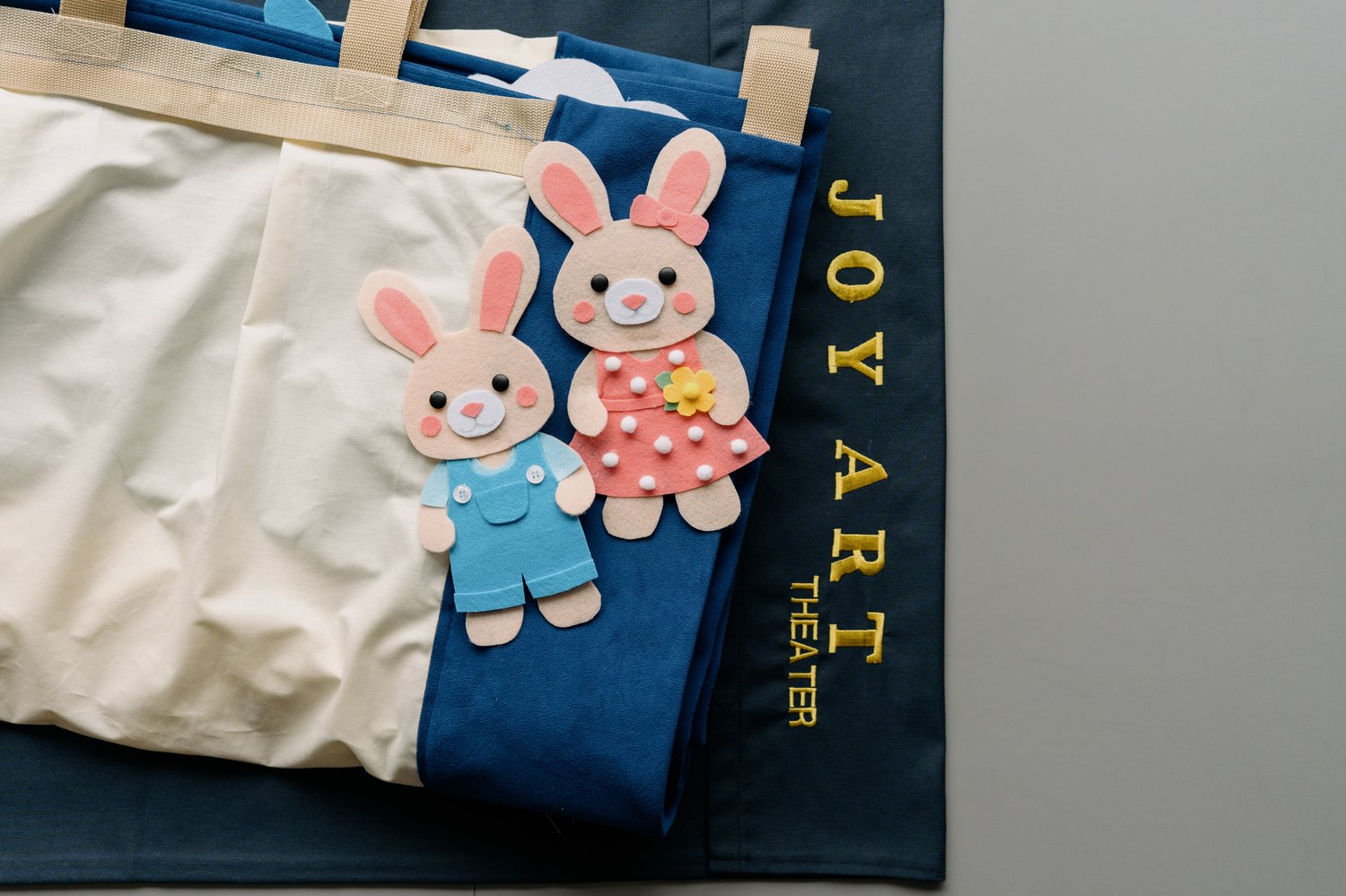 JoyArt storage cover pouch with handmade felt Easter bunny puppets — PDF sewing pattern bundle by MUNA Patterns