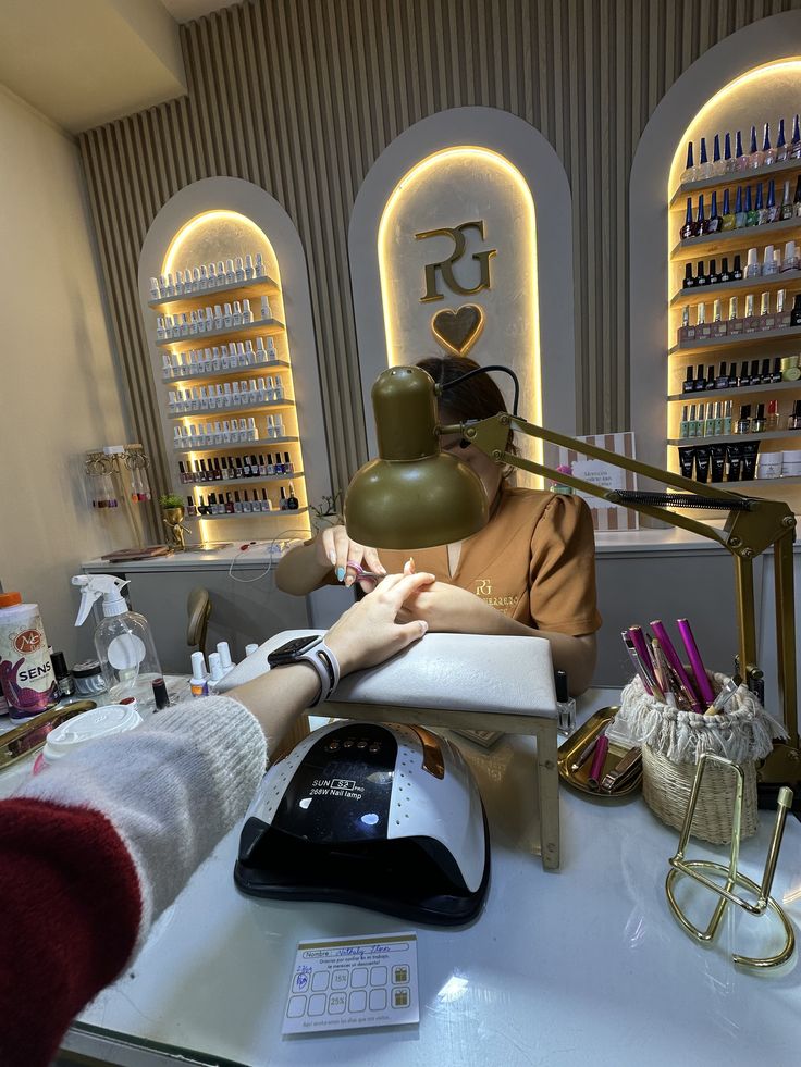 Nail client receiving a referral card to share with friends, promoting loyalty and new bookings.