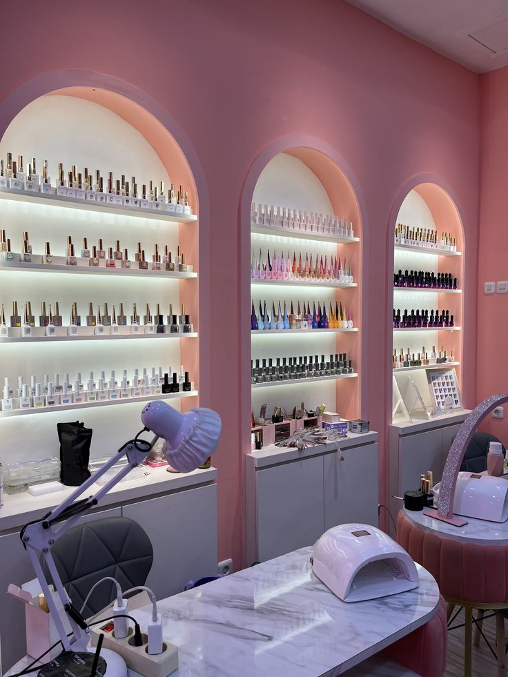 Nail technician capturing a client’s manicure for social media promotion in a bright, modern salon.