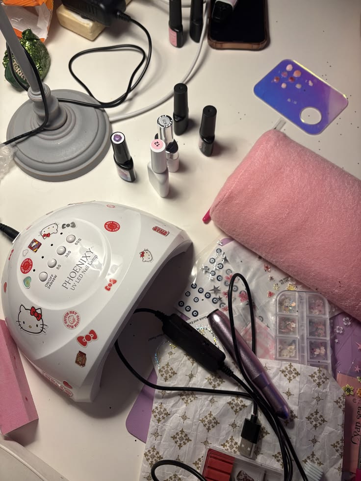 Nail technician managing studio schedule efficiently using digital tools for better client service.