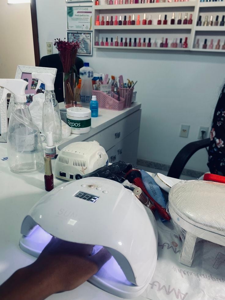 Nail technician incorporating seasonal nail trends efficiently while maintaining service quality.