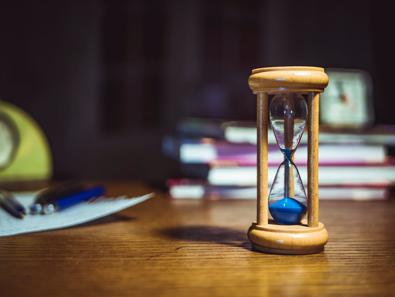 Minimalist hourglass on wooden table