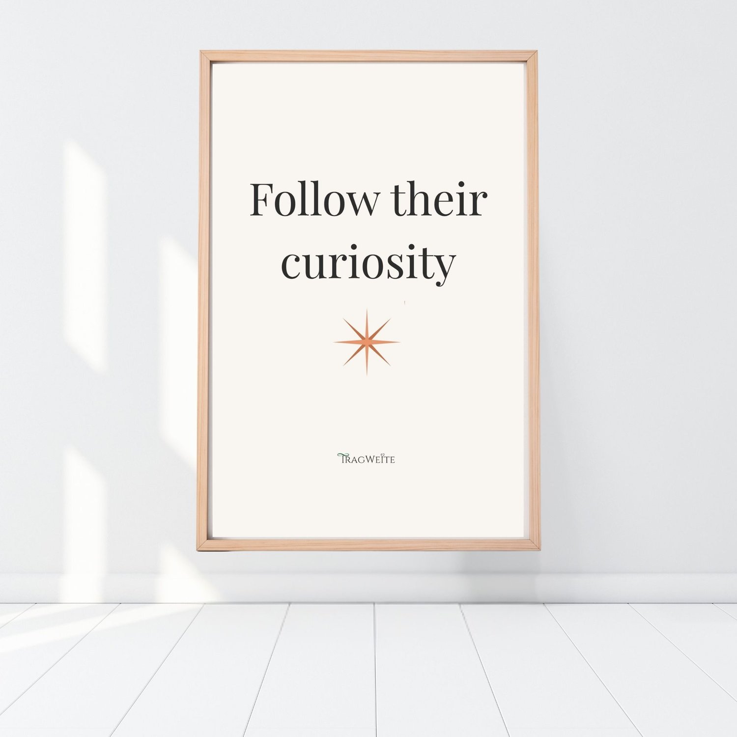 Printable poster "Follow Their Curiosity" leaning on floor – minimalist wall poster for conscious parents