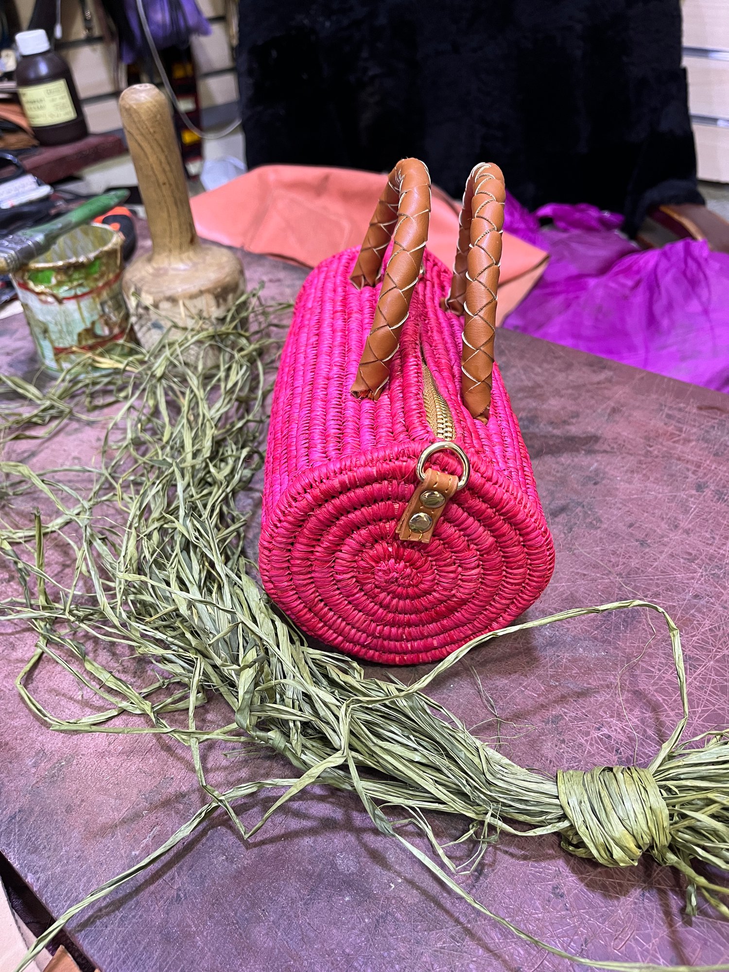Moroccan handmade raffia bag with handles and straps finished in vegan leather.