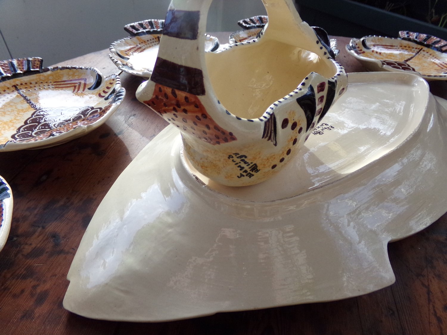 highly sought-after paul fouillen vintage fish plates, platter and saucer