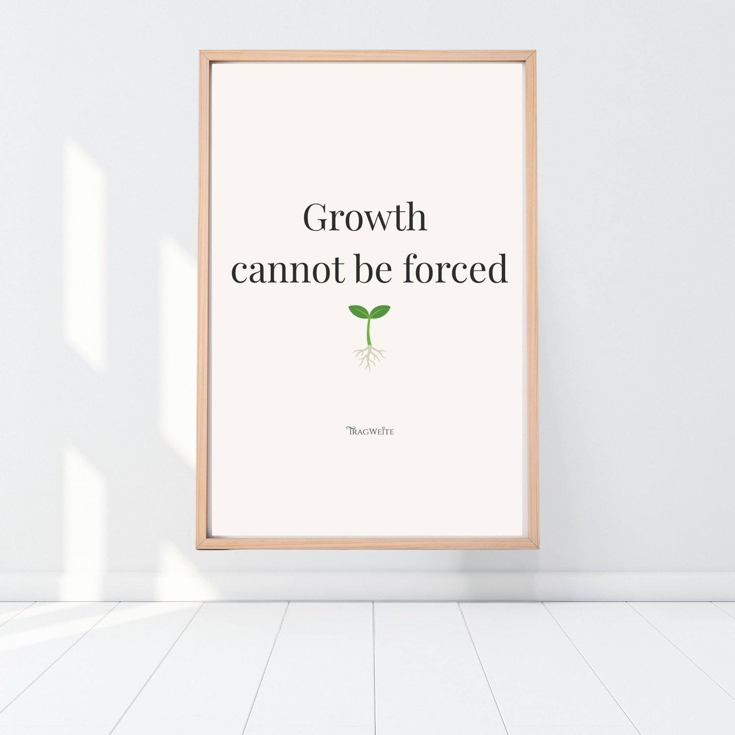 Printable wall poster leaning on white floor, wooden frame, Tragweite