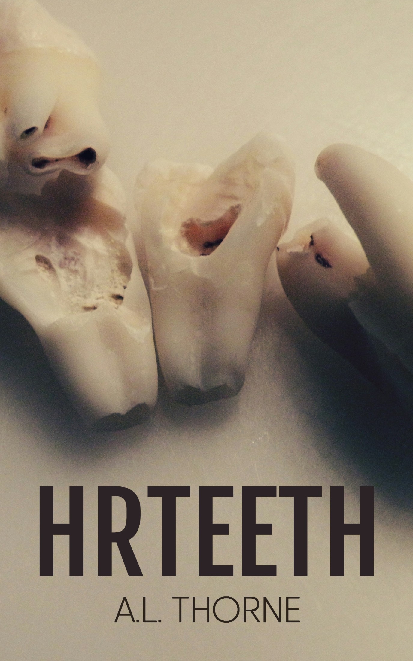 Book cover for HRTeeth by A.L. Thorne. A sepia-toned image of three large human teeth.