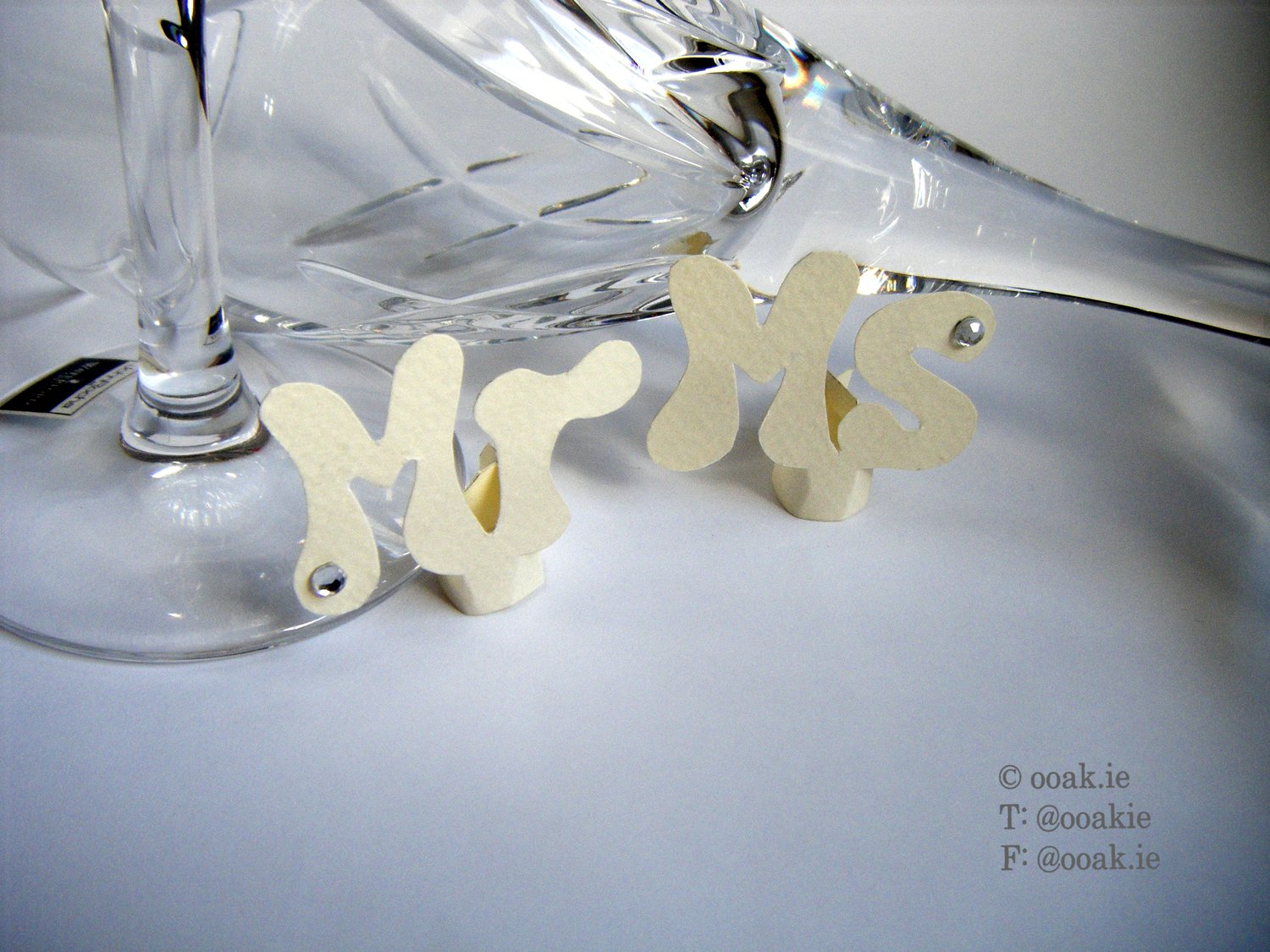 Mr and Ms wine glass tags made from cream card embellished with crystals