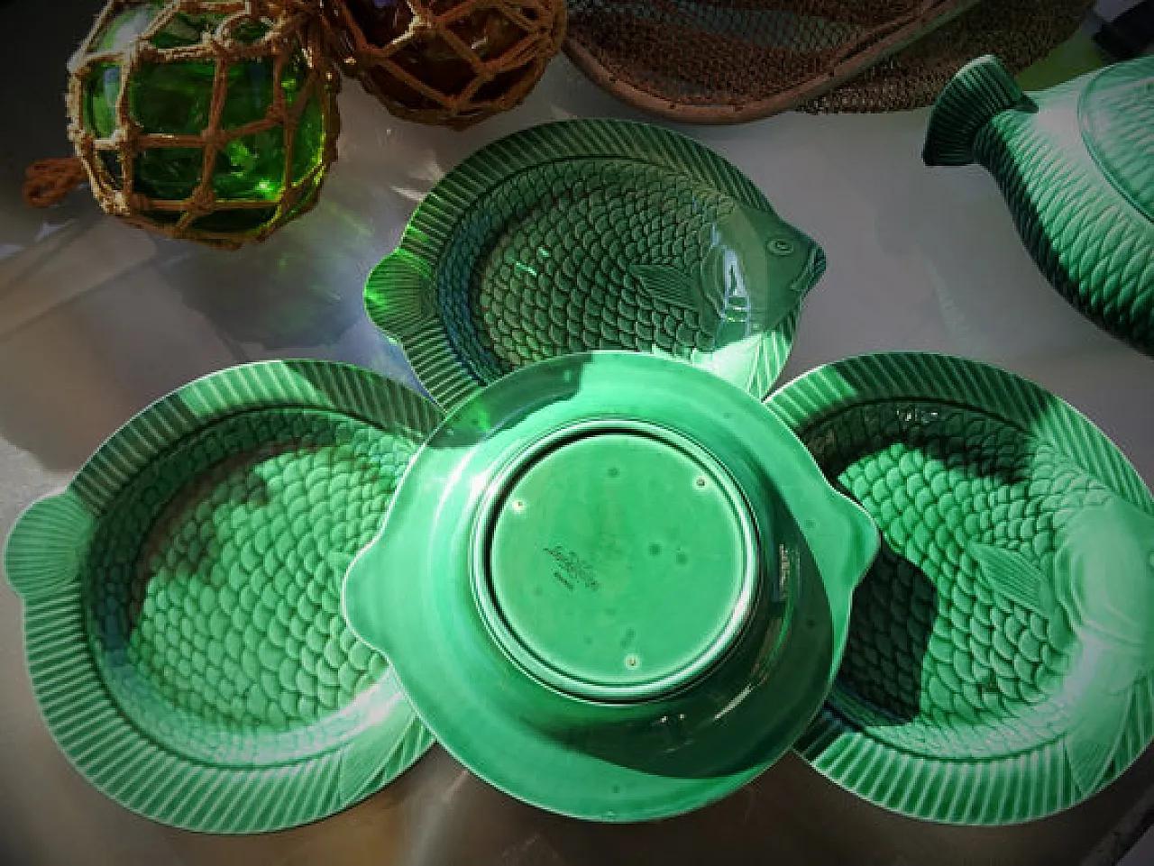 Sarreguemines fish plates in emerald green, mid-20th-century French earthenware serving plates