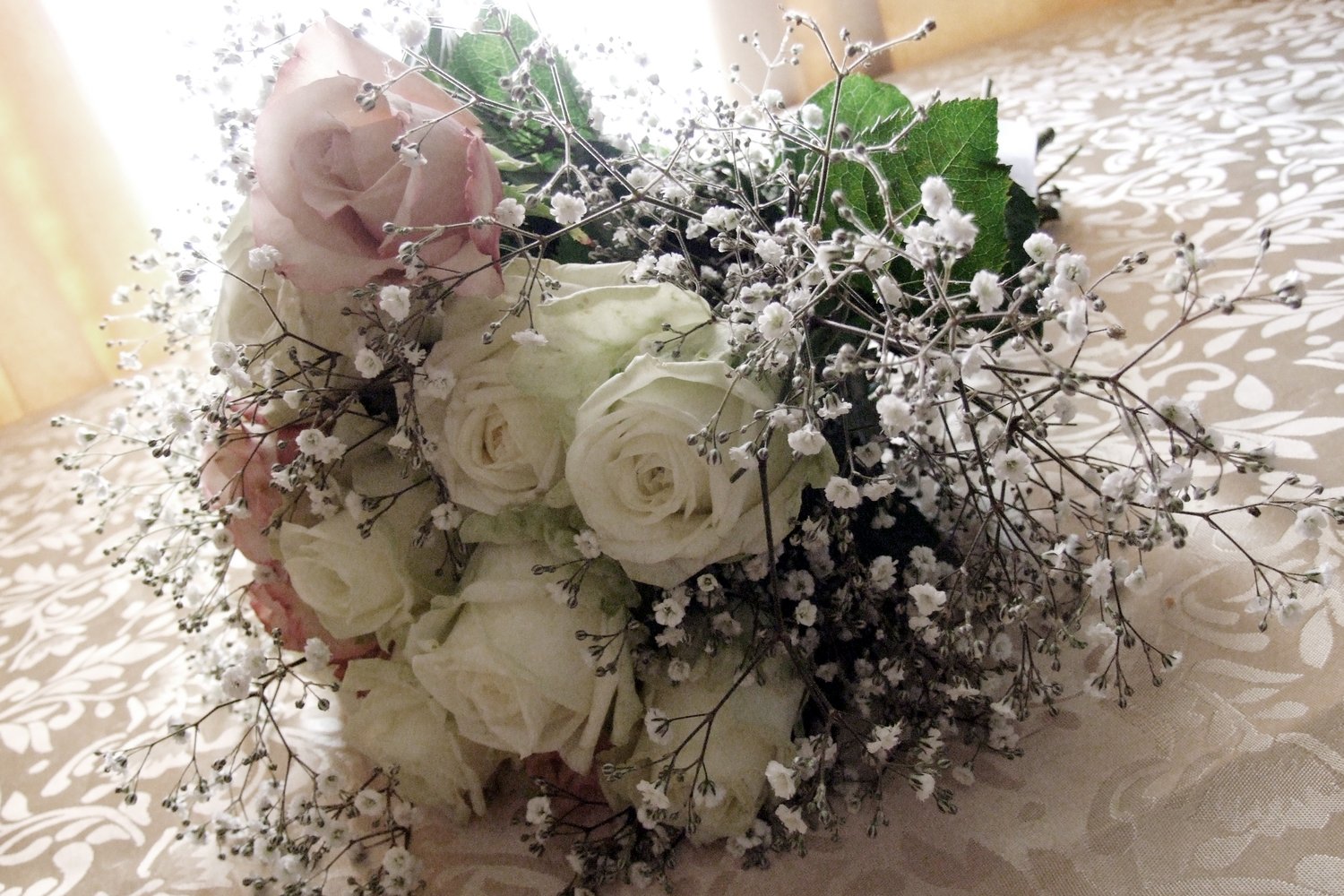 Rose floral bouquet, evokes romance whether its a legals only or a full wedding ceremony. A bouquet can be held in the tradition, or used as decoration.