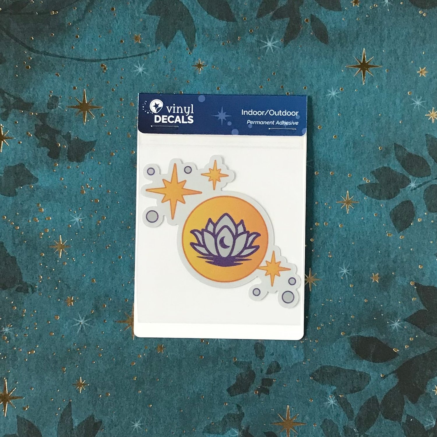 The lunar lotus decal shown in its packaging.