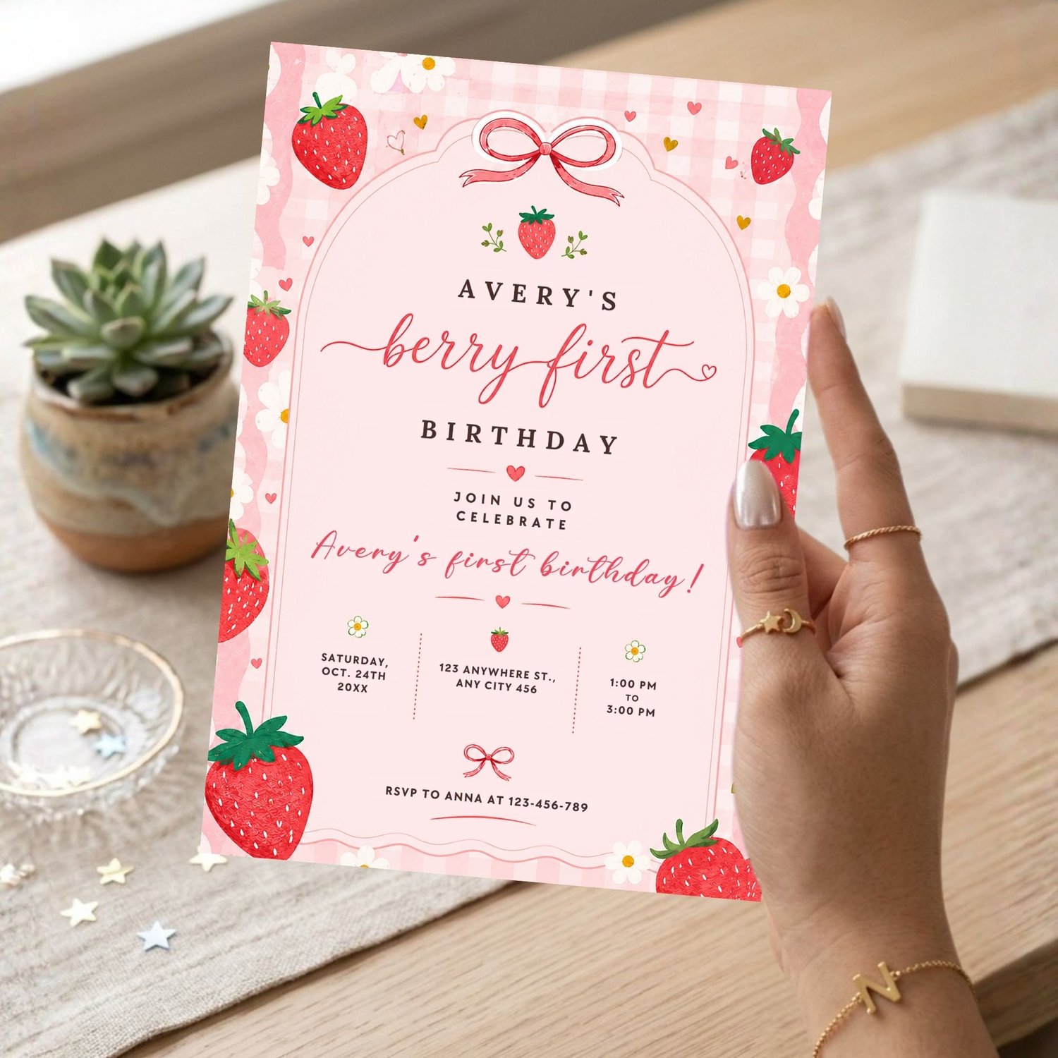 Editable Berry First Birthday Invitation Canva template with personalized party details, strawberry birthday theme and pink gingham design.