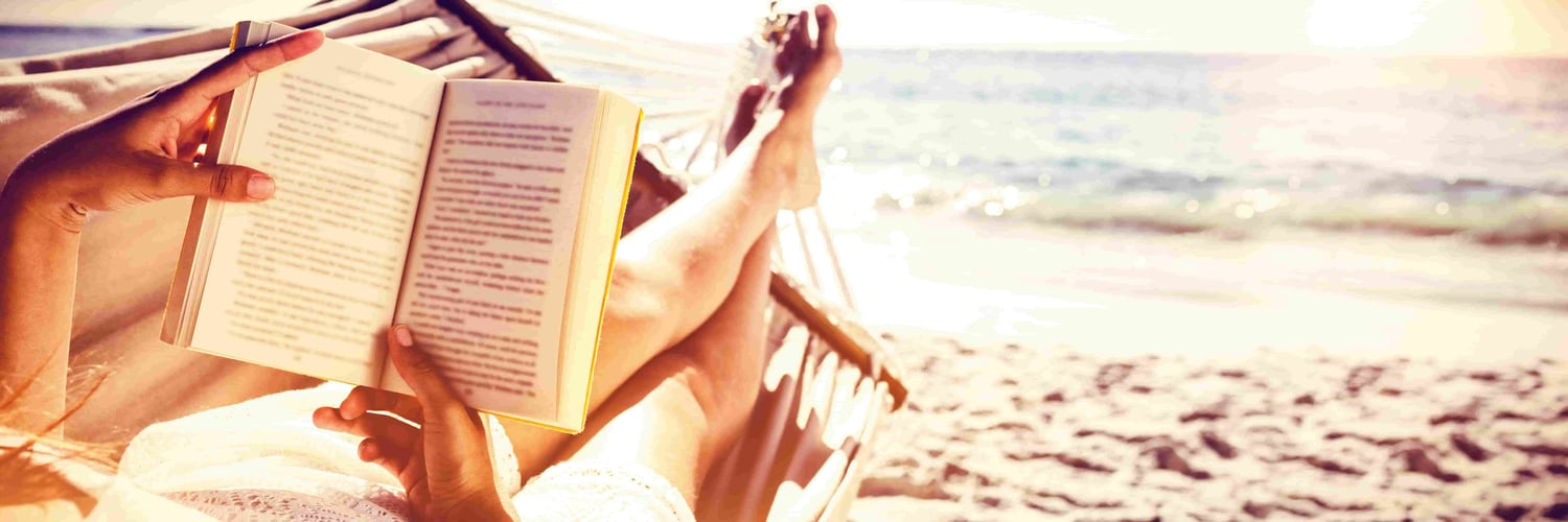 relaxing reading romance on a beautiful beach