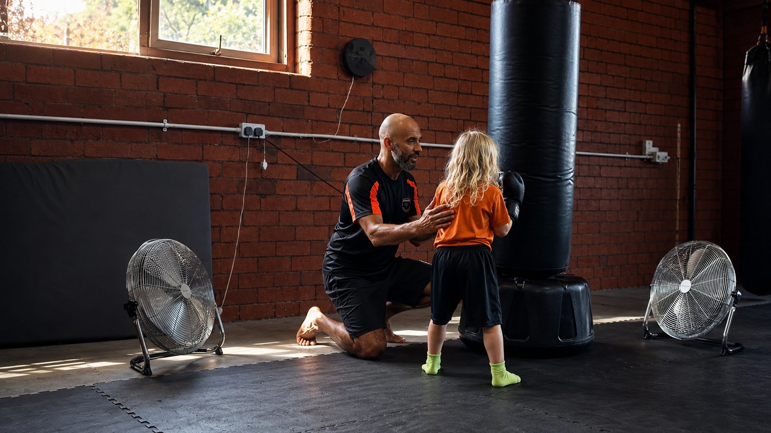 martial arts instructor helping student