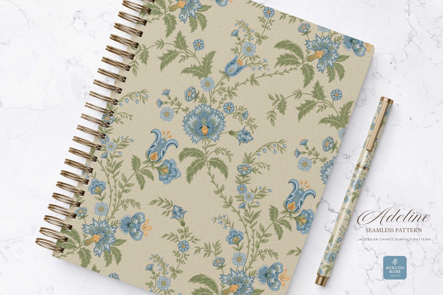 Hand drawn seamless surface pattern featuring intricate, stylized florals and climbing vines in blue, yellow, and green on a notebook