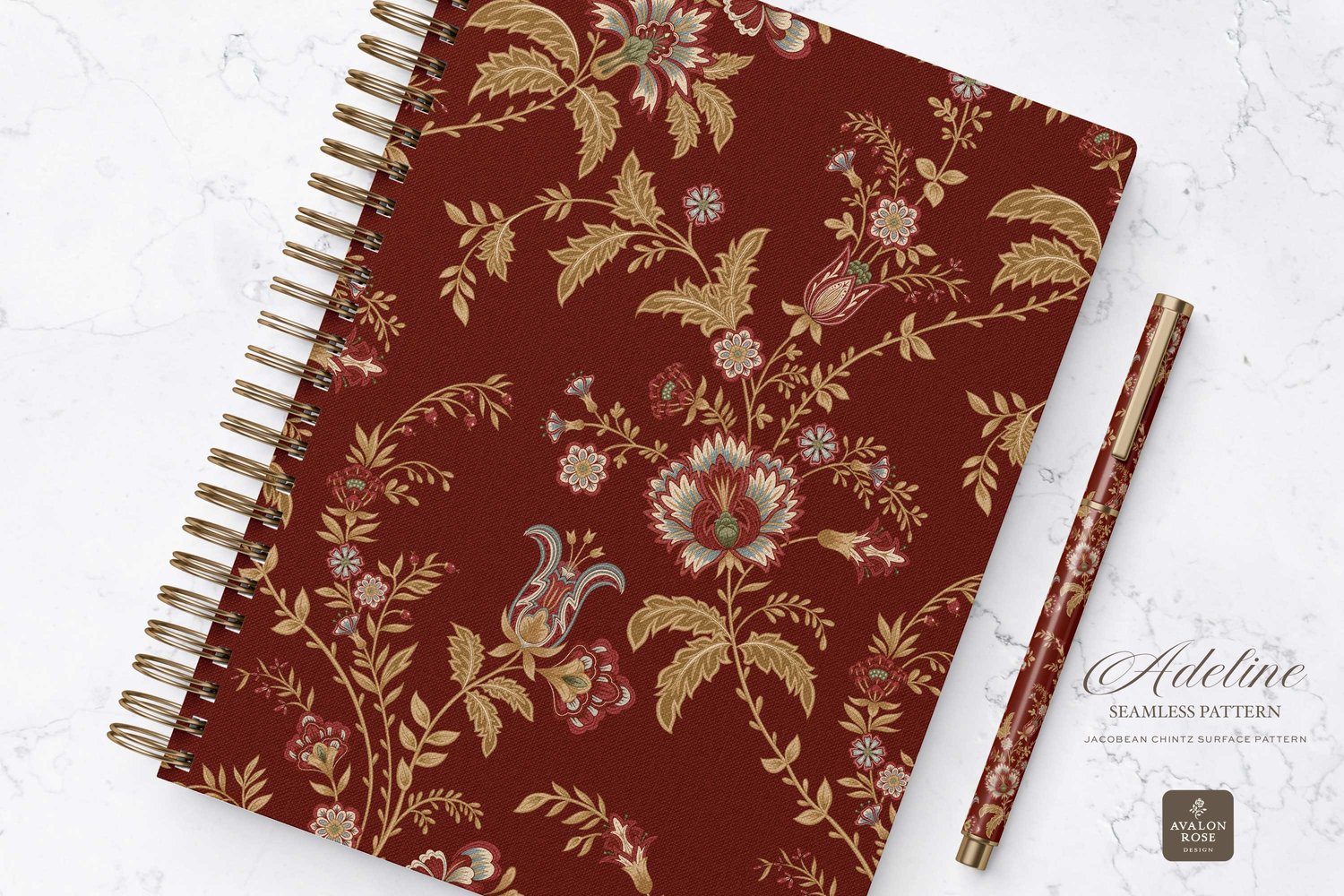 Hand drawn seamless surface pattern featuring intricate, stylized florals and climbing vines in red and gold on a notebook