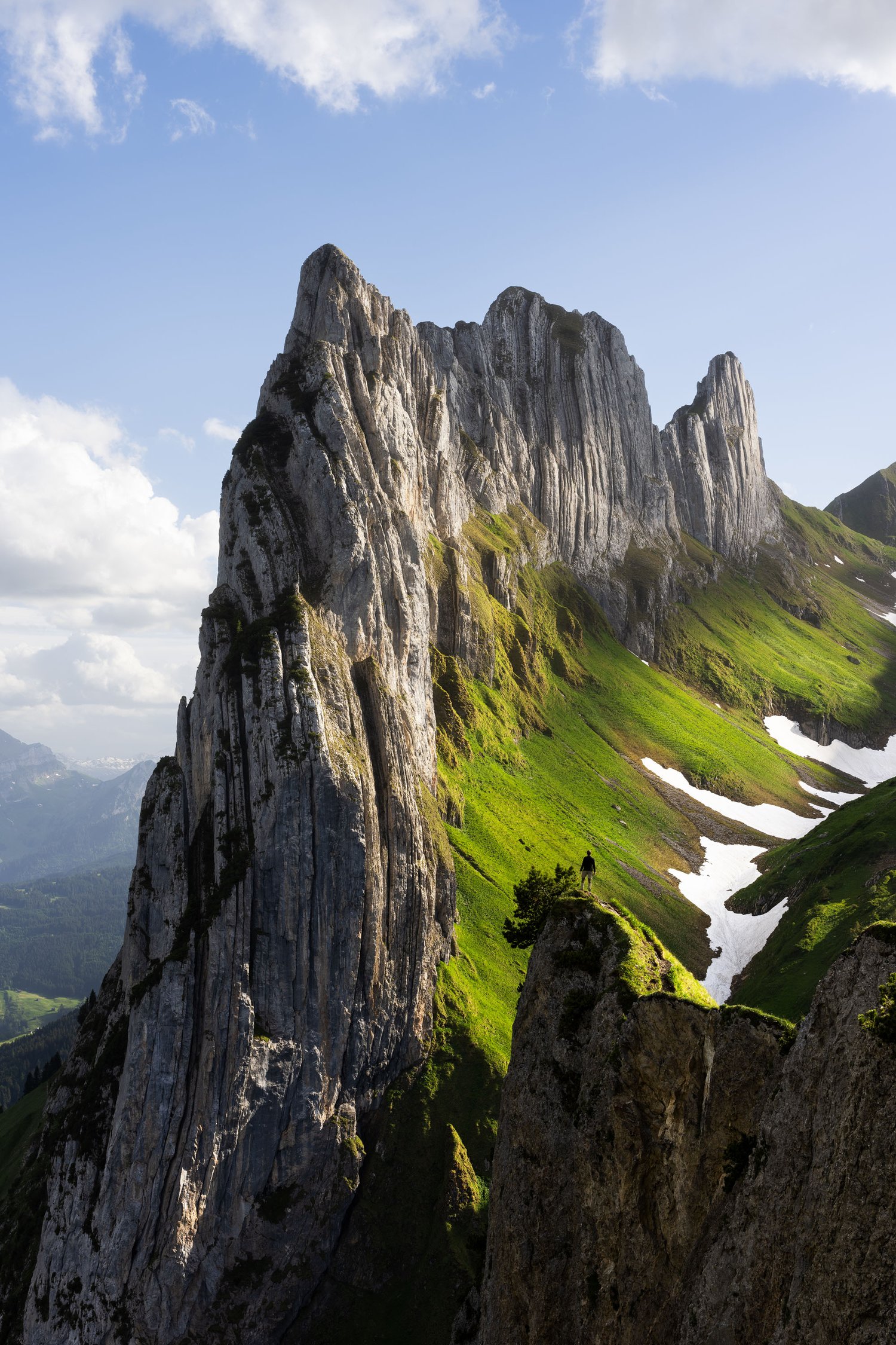 Switzerland Saxer Lücke cliffs mountains landscape photography dappled light 2 person long lens_1