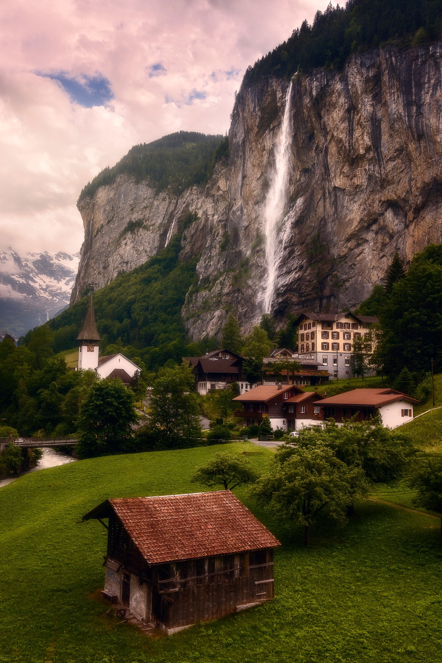 Lauterbrunnen switzerland view from train summer clouds waterfall