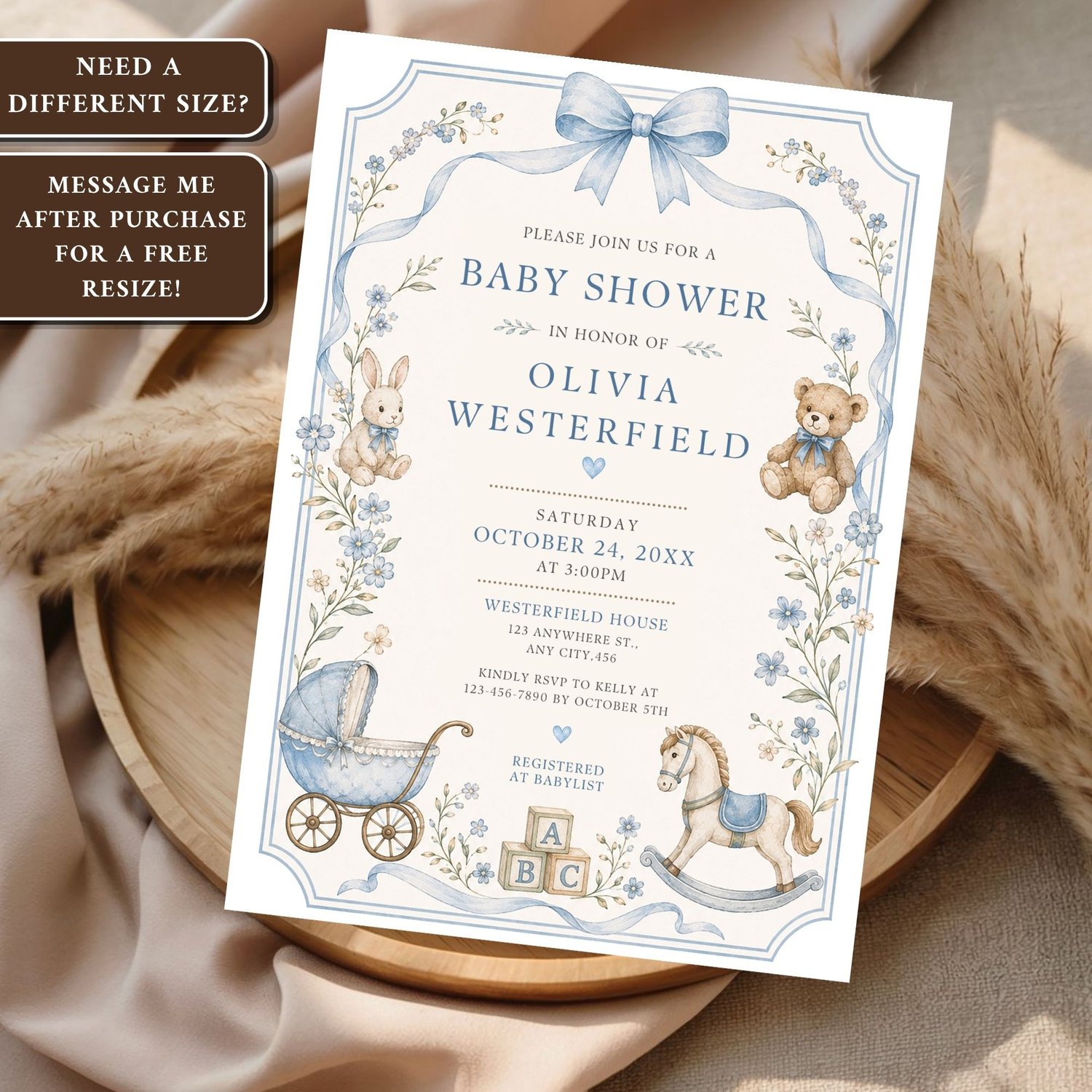 Vintage nursery baby shower invitation with a teddy bear, rocking horse, alphabet blocks, and blue floral accents. Editable printable Canva template for a baby boy celebration.