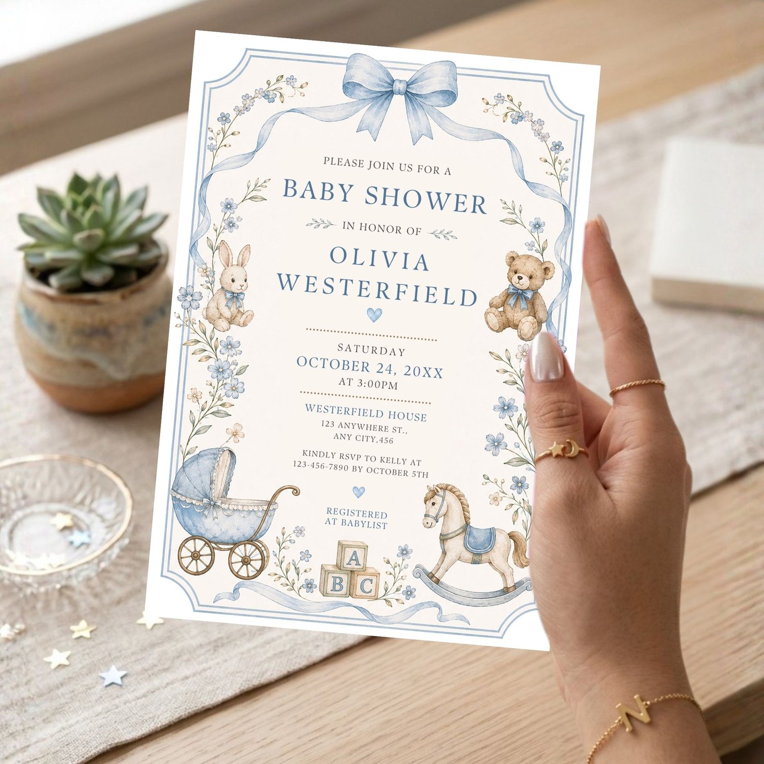 Printable baby boy shower invitation with a classic rocking horse, teddy bear, blue watercolor florals, and vintage nursery theme. Editable Canva digital download.