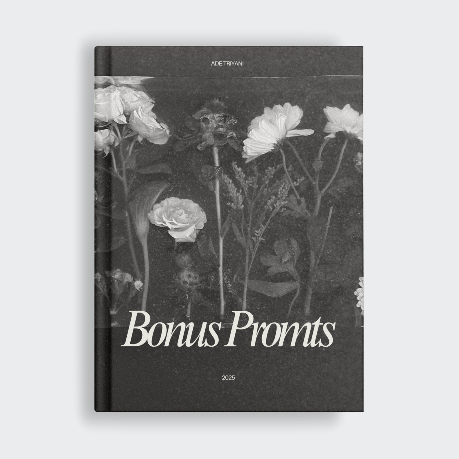 Dark moody hardcover book mockup titled 'Bonus Prompts' by Ade Triyani, 2025, featuring a black-and-white vintage floral photograph cover.