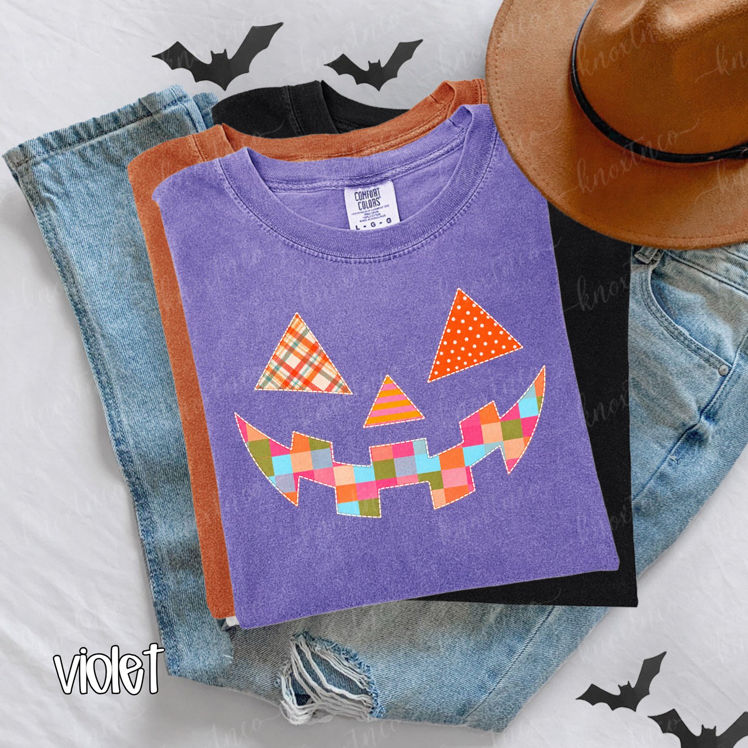 A soft Comfort Colors® tee featuring a colorful quilt-look jack-o’-lantern with playful patchwork patterns and faux stitched details. A cheerful choice for Halloween parties, pumpkin-patch trips, fall festivals, and everyday autumn outfits.