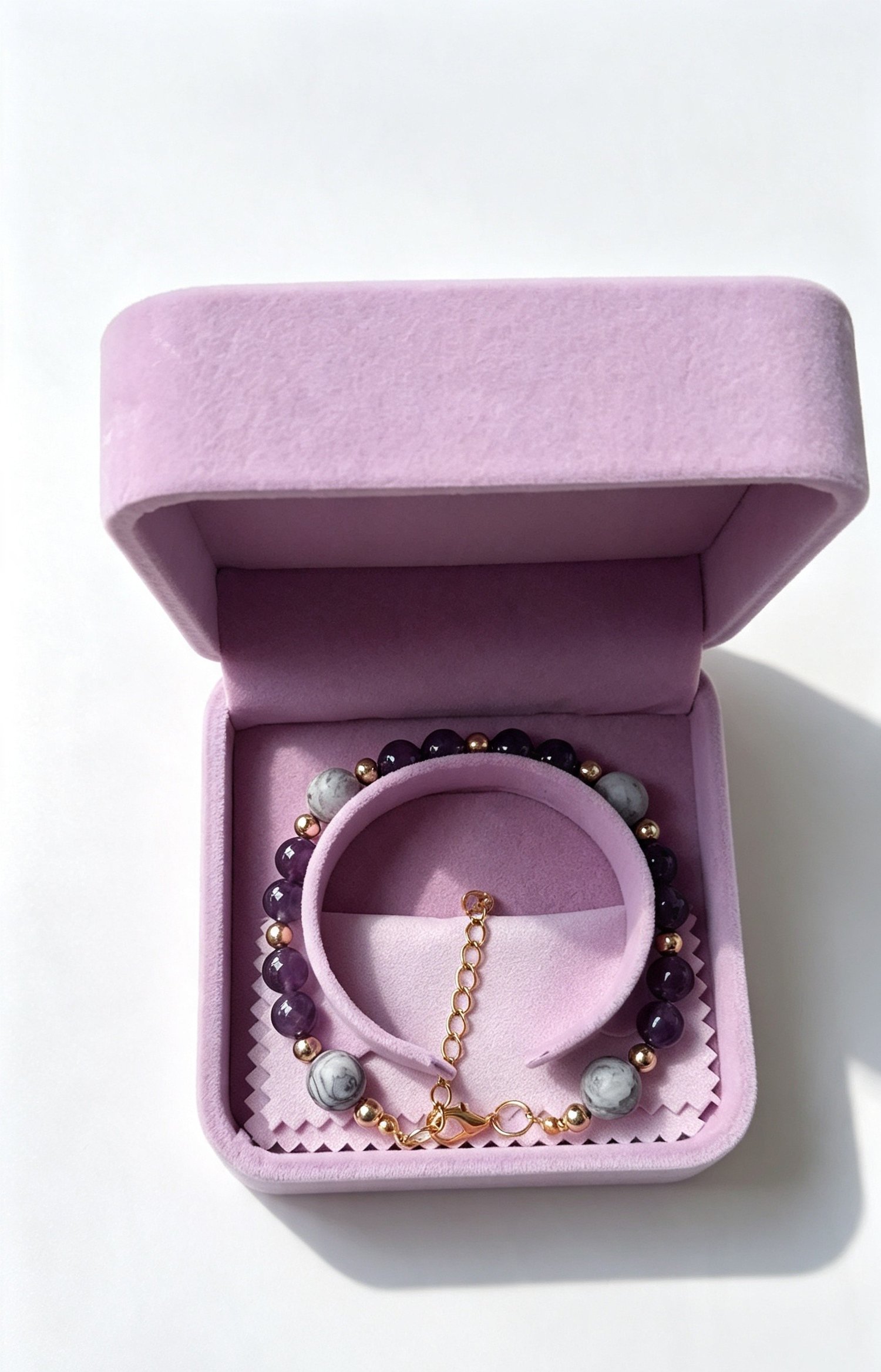 Amethyst glass and Map Jasper bracelet presented in a lilac jewellery gift box