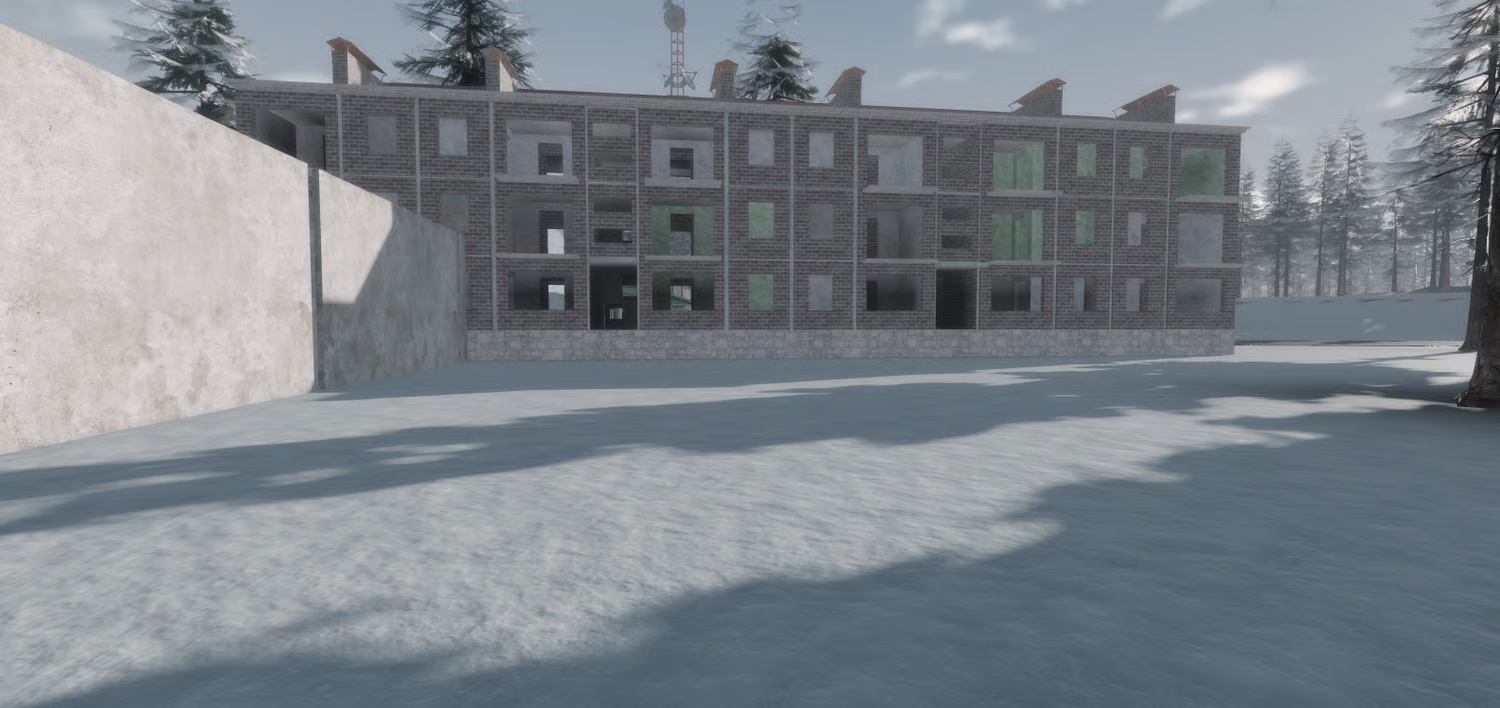Large unfinished Soviet apartment building in winter driving map